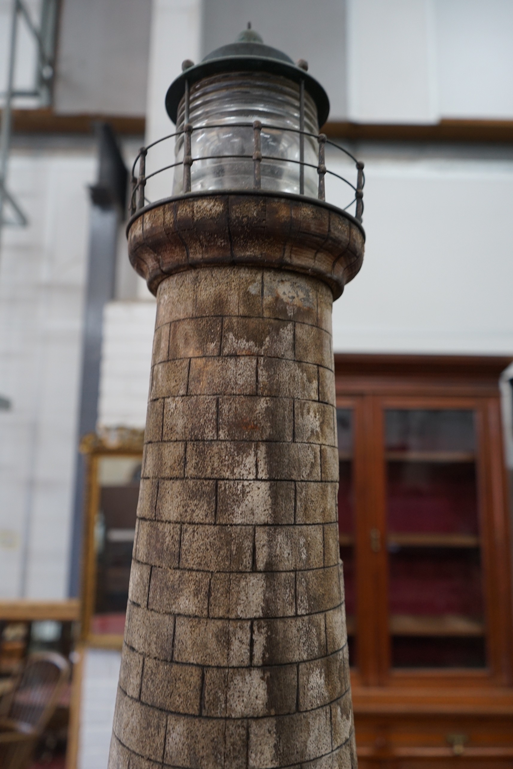 A vintage brick effect wood model lighthouse, wired for electricity height 110cm